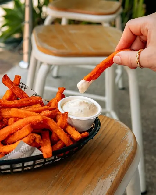 Sweet potato fry dipped in truffle mayo